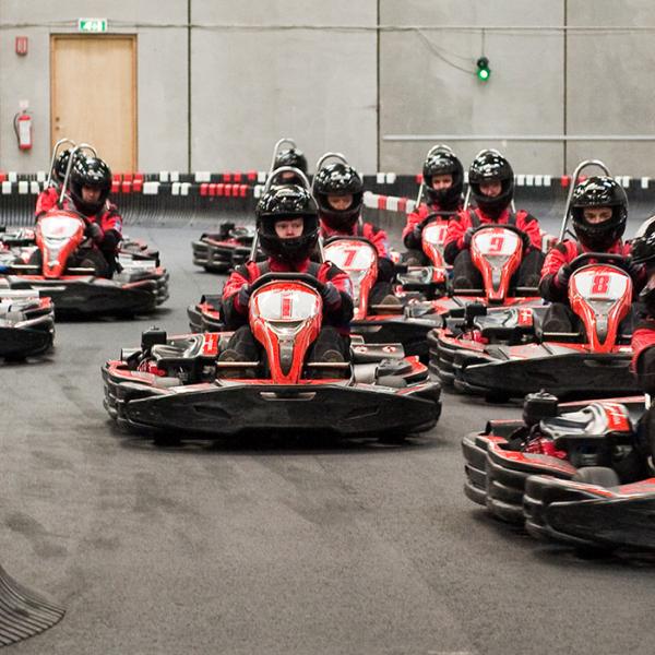 3 children race in go-karts. Children from 7 years old, and 120 cm tall, can drive in specially built go-karts. The whole family can enjoy a day of fun and thrills.