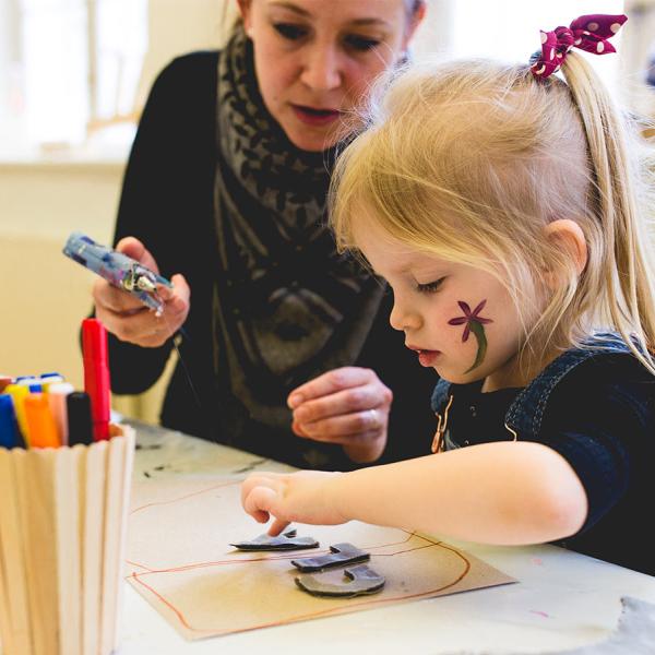 Get creative like this girl. Glue, cut and paint at the Nicolai experience centre for children. Climb ropes and build cushion towers. Explore the sensory room and much more. A wonderful day out in the world's best family holiday for children at LEGOLAND® Billund Resort.