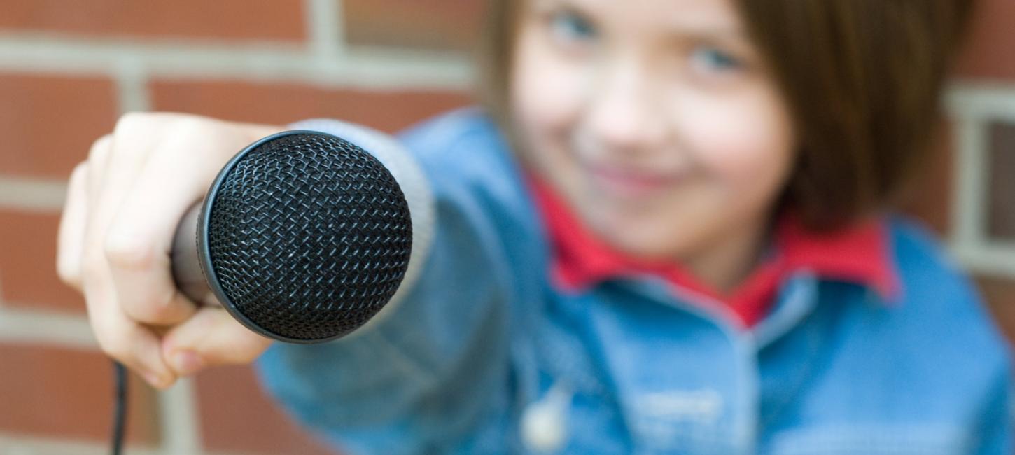 A girl is holding a microphone. She is ready to conduct an interview. The press are always welcome at LEGOLAND® Billund Resort. Read more here.