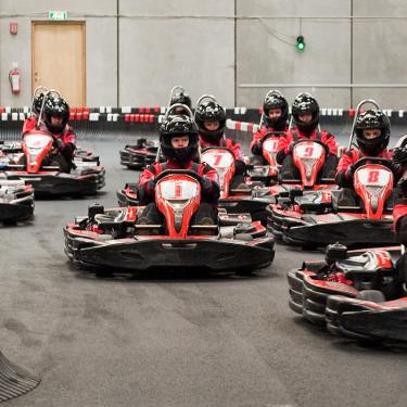 3 children race in go-karts. Children from 7 years old, and 120 cm tall, can drive in specially built go-karts. The whole family can enjoy a day of fun and thrills.