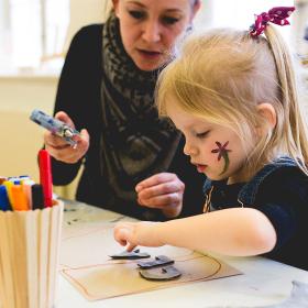 Get creative like this girl. Glue, cut and paint at the Nicolai experience centre for children. Climb ropes and build cushion towers. Explore the sensory room and much more. A wonderful day out in the world's best family holiday for children at LEGOLAND® Billund Resort.
